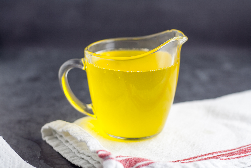 How to Make Clarified Butter in the Microwave Tutorial - Learn how to make clarified butter in the microwave in just 5 simple steps. Drawn butter is perfect for your favorite seafood and so easy to make! Wow! This will be perfect the next time we have surf and turf at home!