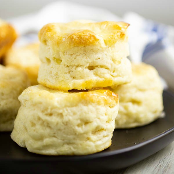These simple homemade Southern Buttermilk Biscuits are flaky and tender. They're easy to make at home from scratch. Slather them in butter and see just how deliciously light and tender they are.