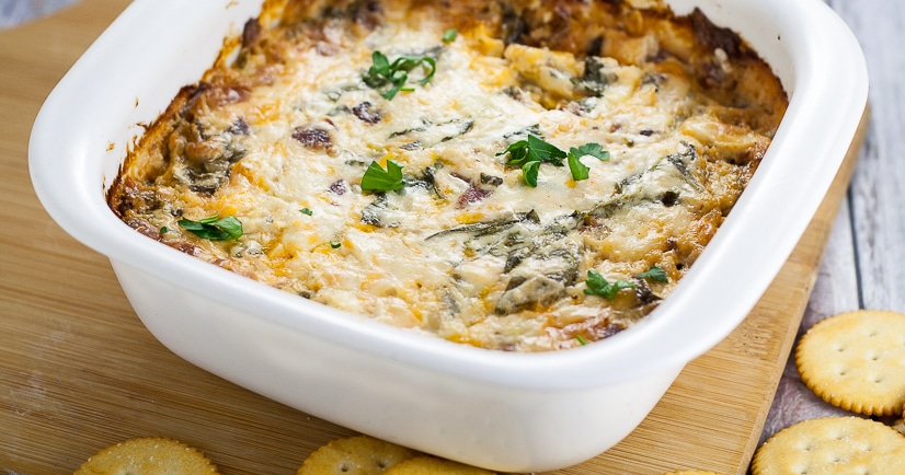 Cheesy Bacon Spinach Dip recipe - Quick, easy, and especially tasty, this Cheesy Bacon Spinach Dip recipe takes just 30 minutes to make, can be made ahead, and is a perfect cozy dip for your next party or gathering! Great easy appetizer recipe for a crowd!