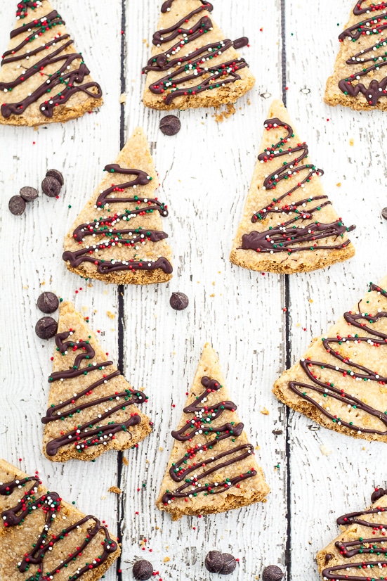 Chocolate Drizzled Shortbread Recipe - A classic buttery shortbread recipe cut into triangles and drizzled with chocolate and festive sprinkles makes this fun Chocolate Drizzled Shortbread cookies look like little Christmas trees.