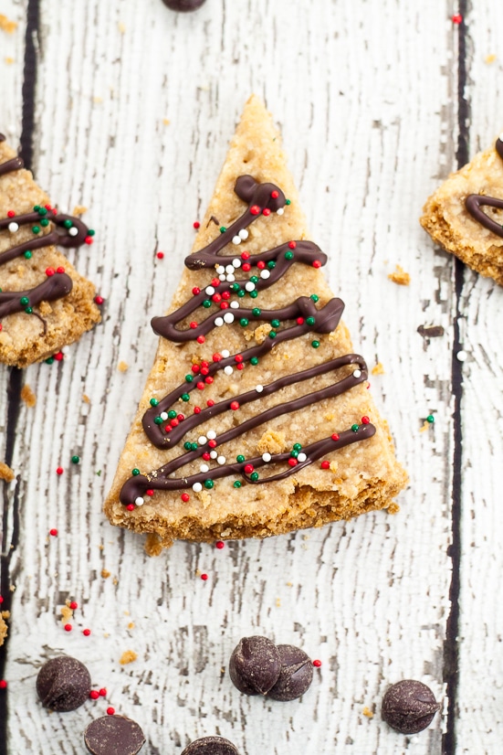 Chocolate Drizzled Shortbread Recipe - A classic buttery shortbread recipe cut into triangles and drizzled with chocolate and festive sprinkles makes this fun Chocolate Drizzled Shortbread cookies look like little Christmas trees.