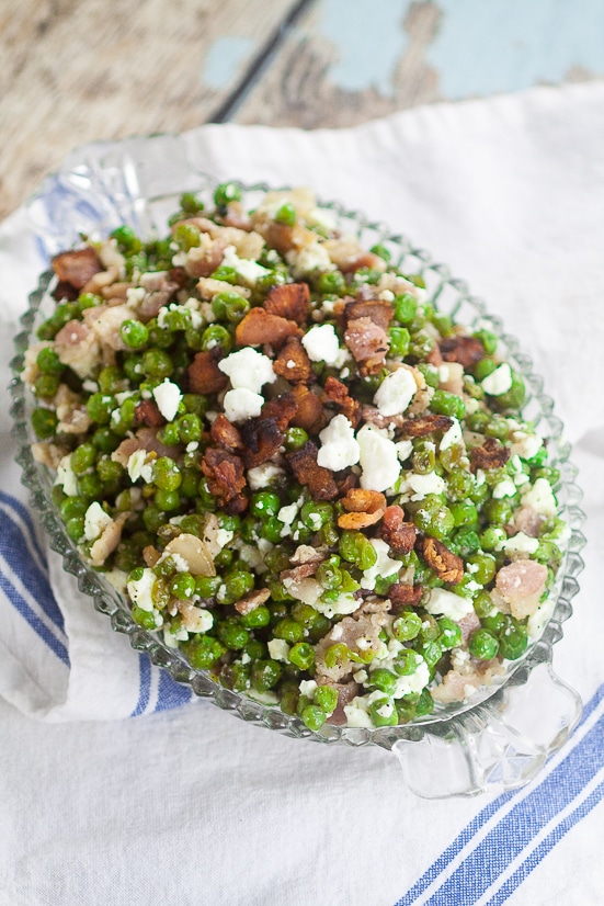 Feta Bacon Peas Recipe - Peas cooked with salty crunchy bacon then tossed with tangy, creamy Feta cheese for a delightful, unique side dish. Make this Feta Bacon Peas quick and easy side dish recipe in just 20 minutes!