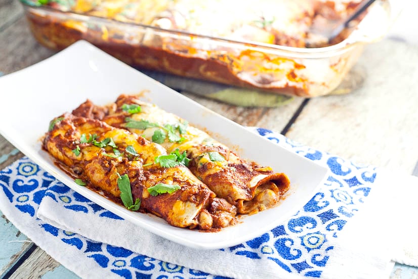 3 Bean Enchiladas Recipe - Quick, easy, and frugal, this 3 Bean Enchiladas recipe with 3 types of beans and lots of cheese is the perfect way to eat vegetarian for a delicious and cheap family dinner recipe!