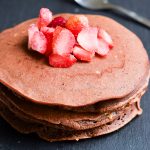 Chocolate Pancakes Recipe - A decadent way to start the day, these Chocolate Pancakes will add a sweet note to your morning.  Top them with berries, whipped cream, or powdered sugar! Amazing for a delicious, decadent, quick and easy breakfast recipe!