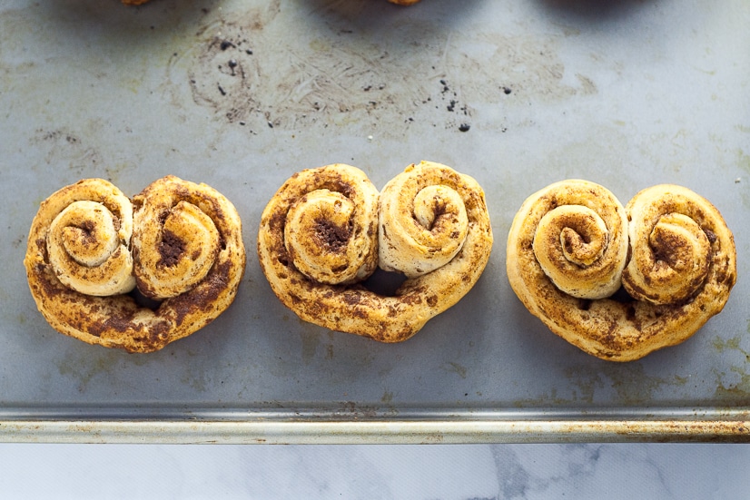 Heart Cinnamon Rolls recipe and tutorial for Valentine's Day - Quick and easy and totally adorable Heart Cinnamon Rolls make a festive Valentine's Day breakfast that the kids will love!