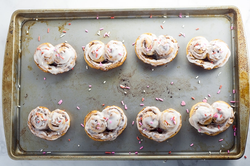Heart Cinnamon Rolls recipe and tutorial for Valentine's Day - Quick and easy and totally adorable Heart Cinnamon Rolls make a festive Valentine's Day breakfast that the kids will love!