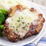 Bacon Swiss Pork Chops Recipe - Juicy pork chops topped with bacon and cheese. This 5 ingredient Bacon Swiss Pork Chops recipe is quick and easy and an instant family favorite! Love this easy family dinner recipe! Can't go wrong with bacon!