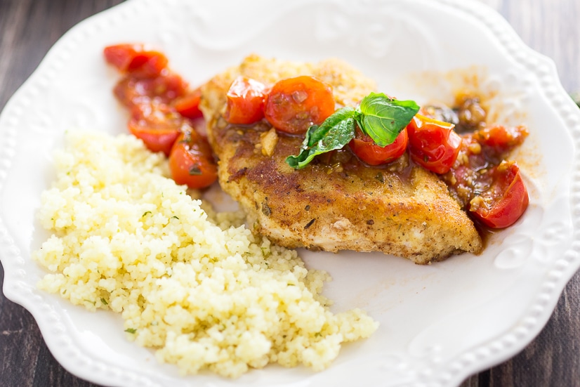 Breaded Chicken with Tomatoes Recipe - Simple but delicious, this Breaded Chicken with Tomatoes recipe has Parmesan Italian breaded chicken breasts with a zesty tomato sauce to make an amazing dinner. 