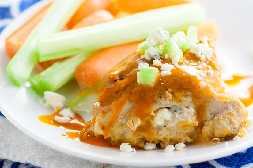 Buffalo Stuffed Chicken Breasts Recipe - Zesty spicy Buffalo Stuffed Chicken Breasts smothered in buffalo sauce and stuffed with creamy blue cheese is an elegant way to enjoy your favorite appetizer for dinner.  