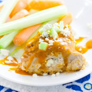 Buffalo Stuffed Chicken Breasts Recipe - Zesty spicy Buffalo Stuffed Chicken Breasts smothered in buffalo sauce and stuffed with creamy blue cheese is an elegant way to enjoy your favorite appetizer for dinner.  