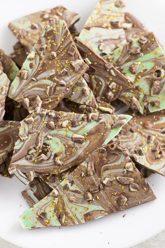Mint Chocolate Bark Recipe - Easy Mint Chocolate Bark recipe with smooth, rich chocolate swirled with mint flavored white chocolate makes a quick, easy, and decadent dessert. YES! Love mint chocolate. This would be perfect for Christmas or St Patrick's Day.