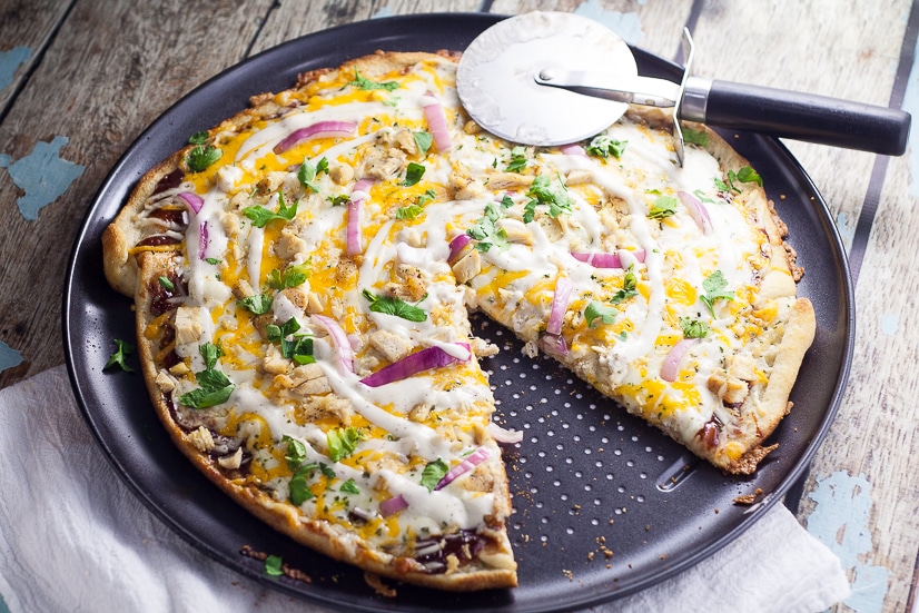Barbecue Ranch Chicken Pizza Recipe - Barbecue and ranch are an unexpected but delicious combination that go perfectly on this Barbecue Ranch Chicken Pizza, along with chicken, red onions and lots of gooey cheese.  Perfect easy family dinner recipe!