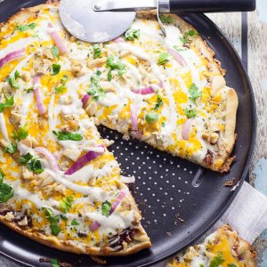 Barbecue Ranch Chicken Pizza Recipe - Barbecue and ranch are an unexpected but delicious combination that go perfectly on this Barbecue Ranch Chicken Pizza, along with chicken, red onions and lots of gooey cheese.  Perfect easy family dinner recipe!