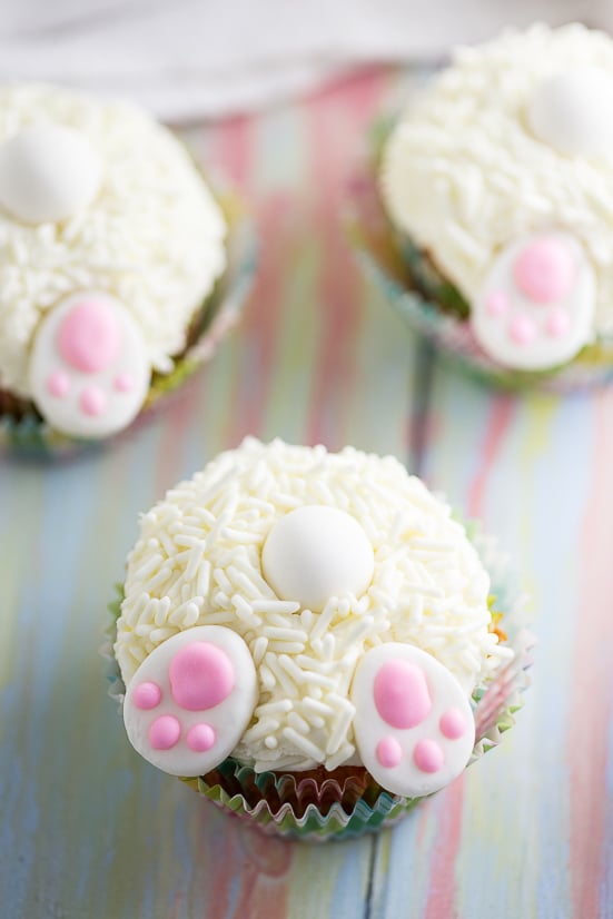 Bunny Butt Cupcakes tutorial - Make these adorable and easy Bunny Butt Cupcakes as a silly Easter treat for kids. Little bunny butts on top of your favorite cupcakes will make the cutest Easter cupcakes around!