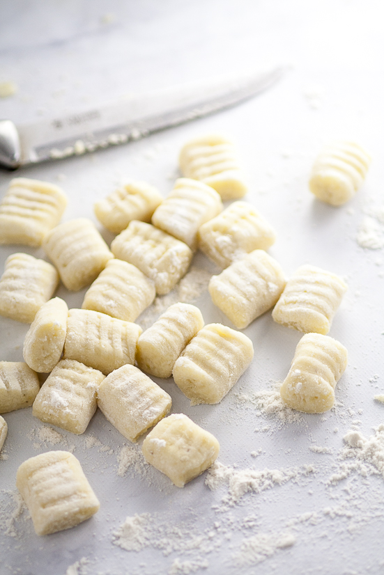 Homemade Potato Gnocchi Recipe - If you've ever wondered if you can make your own Homemade Potato Gnocchi, you can! With this easy, detailed recipe and tutorial, you'll be making your new favorite gnocchi like a pro in no time! Make your own homemade potato gnocchi to put in your favorite pasta recipe. 