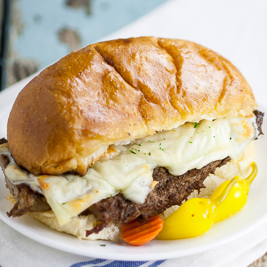 Steak Po' Boys recipe - Juicy steak and creamy cheese on a warm garlic buttery roll make these Steak Po' Boys a heavenly experience and they're so easy to make too! Perfect for a quick and easy family dinner recipe. 6 ingredients and just 20 minutes!