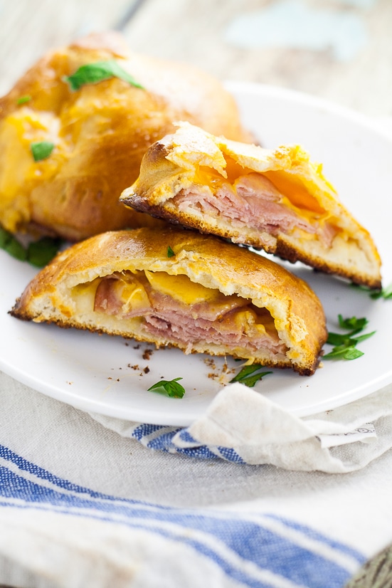 Ham and Cheese Pockets Recipe - For a quick and easy, on-the-go meal make these yummy, cheesy Ham and Cheese Pockets with just 5 ingredients in 30 minutes or less! They're freezer friendly too!