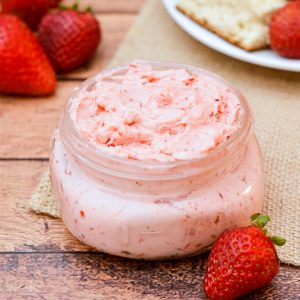 Whipped Strawberry Butter recipe - Sweet and fresh Whipped Strawberry Butter goes perfectly on your favorite roll, biscuit, or scone for a refreshing and yummy treat. Make it in just 10 minutes with 3 ingredients! Yummy and easy DIY gift idea too! Just put it in a mason jar and tie a bow with twine.  