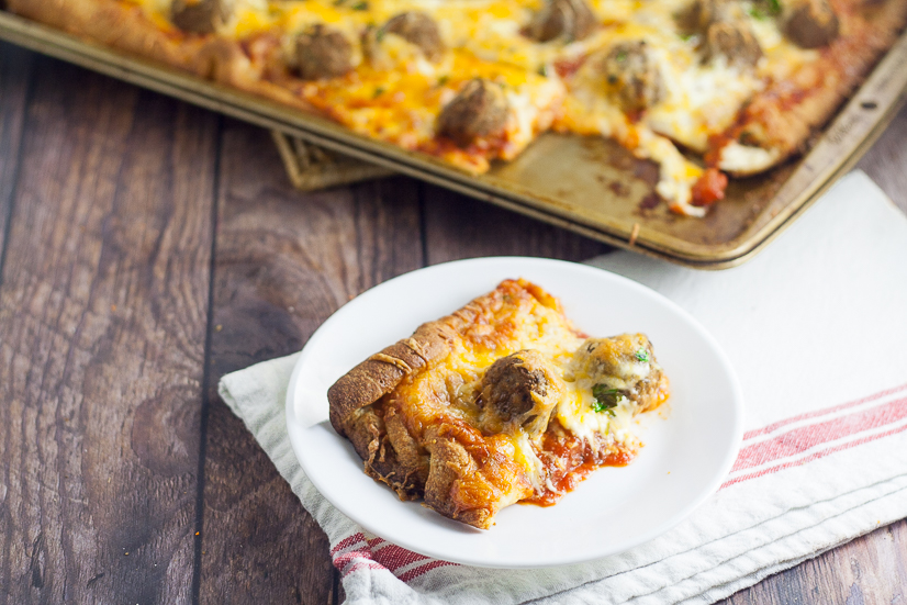 Meatball Pizza Recipe - A quick and easy recipe for Meatball Pizza that even the kids can help with! Crispy crust, gooey cheese, and Italian meatballs make the perfect family pizza night! Quick and easy family dinner recipe the kids will LOVE!