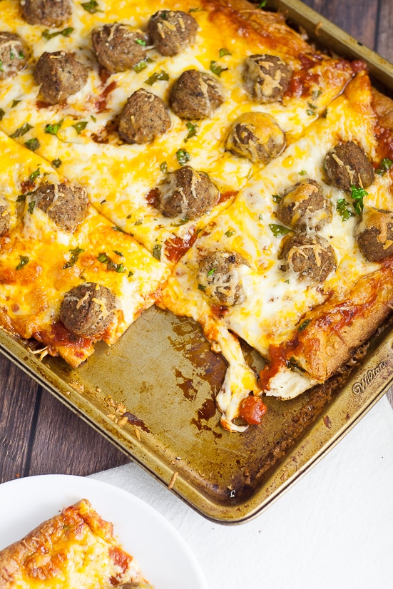 Meatball Pizza Recipe - A quick and easy recipe for Meatball Pizza that even the kids can help with! Crispy crust, gooey cheese, and Italian meatballs make the perfect family pizza night! Quick and easy family dinner recipe the kids will LOVE!