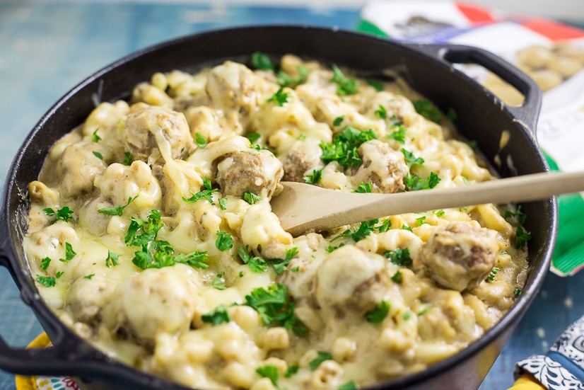 Swedish Meatball Mac and Cheese Recipe - Make this Swedish Meatball Mac and Cheese recipe, with flavorful Swedish meatballs, authentic gravy, and lots of gooey cheese, in 30 minutes for a quick and easy family dinner recipe! Takes macaroni and cheese and Swedish meatballs to a whole new amazing comfort food level.