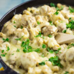 Swedish Meatball Mac and Cheese Recipe - Make this Swedish Meatball Mac and Cheese recipe, with flavorful Swedish meatballs, authentic gravy, and lots of gooey cheese, in 30 minutes for a quick and easy family dinner recipe! Takes macaroni and cheese and Swedish meatballs to a whole new amazing comfort food level.