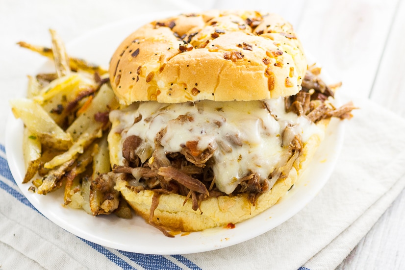 Slow Cooker Chipotle Beef Sandwiches Recipe - This Slow Cooker Chipotle Beef Sandwiches recipe is a zesty new take on classic pulled beef that's super easy to make right in the Crock Pot. Just serve on a bun with cheese! Easy slow cooker recipe that the family will love