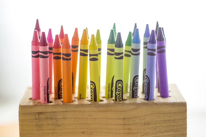 DIY Easy Crayon Organizer tutorial - Make this quick and easy Crayon Organizer for the kids to store their crayons or even colored pencils or markers. It's cheap, easy to make, easy to use, and a pretty way to organize the coloring mess! Perfect easy craft supplies organization for kids!