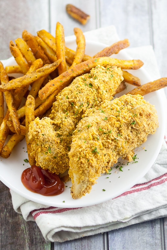 Easy Baked Chicken Tenders Recipe - Use this quick and easy recipe with basic, simple ingredients to make your own homemade Easy Baked Chicken Tenders that both you and the kids will love! Perfect easy food for kids