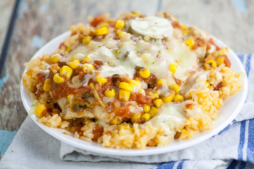 Skillet Southwest Smothered Chicken Recipe - Cheesy and zesty and made in just 30 minutes in one skillet! This Skillet Southwest Smothered Chicken recipe has it all and will be a new family favorite! Quick and easy family dinner recipe 