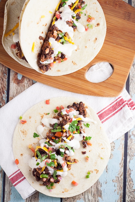  Sriracha Ranch Black Bean Tacos Recipe - Spicy and creamy Sriracha Ranch Black Bean Tacos are way better than your average black bean tacos.  They make a fabulous meatless family dinner.
