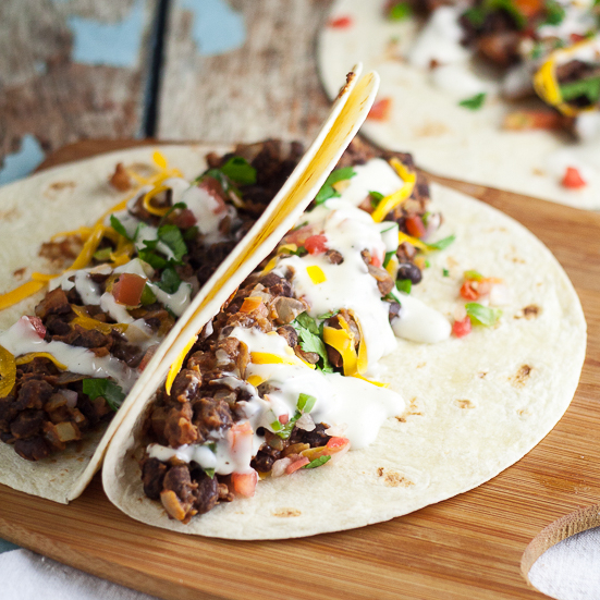  Sriracha Ranch Black Bean Tacos Recipe - Spicy and creamy Sriracha Ranch Black Bean Tacos are way better than your average black bean tacos.  They make a fabulous meatless family dinner.