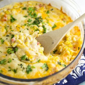 Cheesy Corn Bake Recipe - This Cheesy Corn Bake recipe is creamy, cheesy, and warm. Basically your perfect casserole and comfort food dream! Perfect for a hearty side dish at home, or a dish to pass at a potluck or holiday dinner! Ooooh. This would be an amazing Thanksgiving side dish too!
