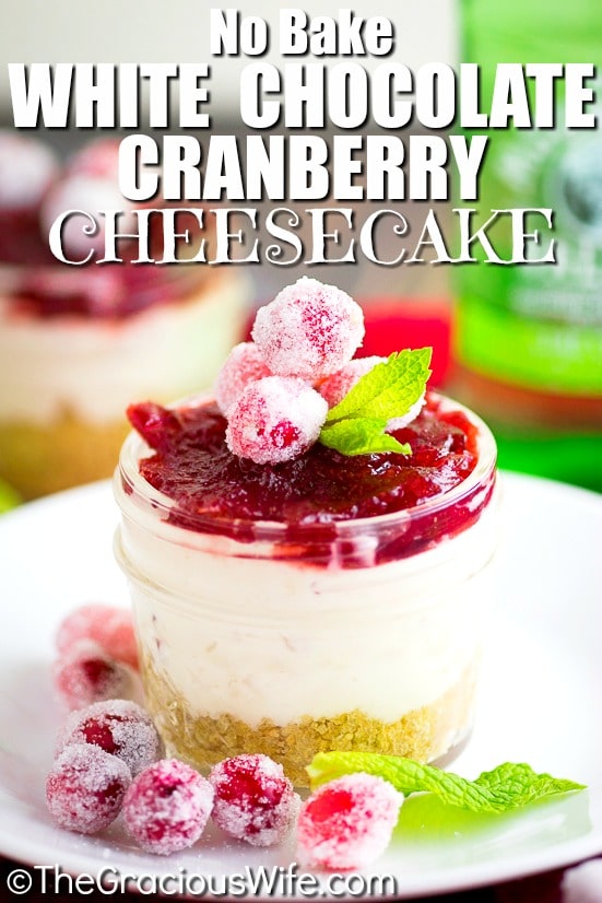 Cranberry White Chocolate Cheesecake Recipe - rich white chocolate no bake cheesecake filling with just 3 ingredients topped with tangy cranberry sauce in a graham cracker crust. Make it a big cheesecake or make mini cheesecakes in jars. 