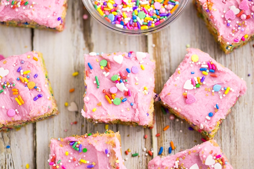 These soft and chewy Frosted Sugar Cookie Bars are the perfect kid-friendly dessert that the whole family will love! Super soft sugar cookie bars piled with vanilla buttercream frosting and lots of sprinkles! So easy to bake since they’re in bar form!