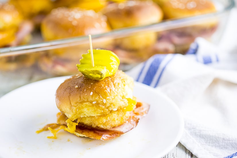 Warm and gooey Ham and Pimento Cheese Sliders take just 5 minutes to prep! Buttery sweet buns, salty ham, creamy and zesty Pimento Cheese Bites make a flavorful explosion in your mouth.  Dip them in the sweet and tangy Red Pepper Jelly sauce to take them from great to drool-worthy. These sliders make an amazing quick and easy snack or easy appetizer. So. Good.