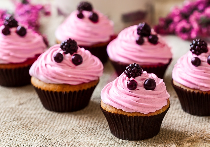 Top your favorite cupcakes with gorgeous swirls of fresh, sweet, and tangy homemade Blackberry Frosting. Make this blackberry frosting to adorn your treats with just 6 ingredients!