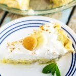 This light and fluffy Banana Cream Pie recipe with pudding is loaded with fresh bananas and silky filling, then topped with piles of  homemade whipped cream and toasted coconut. The end result of this homemade old-fashioned banana cream pie is beyond words. The banana lovers you bake it for will be in pie heaven.