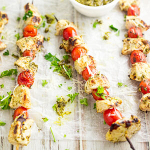 No-fuss, 4 ingredient Pesto Chicken Kabobs just scream summer, made with basil pesto and fresh cherry or grape tomatoes and juicy chicken. Makes a super quick and easy healthy dinner that's perfect for summer grilling!