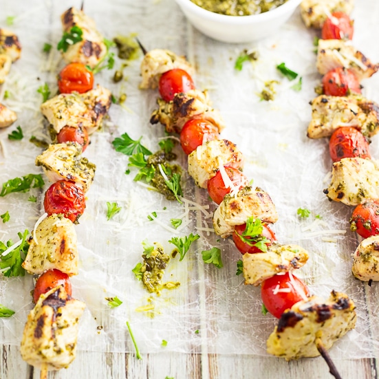No-fuss, 4 ingredient Pesto Chicken Kabobs just scream summer, made with basil pesto and fresh cherry or grape tomatoes and juicy chicken. Makes a super quick and easy healthy dinner that's perfect for summer grilling!