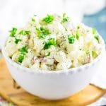 Creamy Southern Red Potato Salad with red potatoes, hard boiled eggs, mayo, mustard, and relish. Once you try this amazing potato salad recipe, you'll never make potato salad any other way! Perfect for potlucks, BBQs, cookouts, and basically every day!