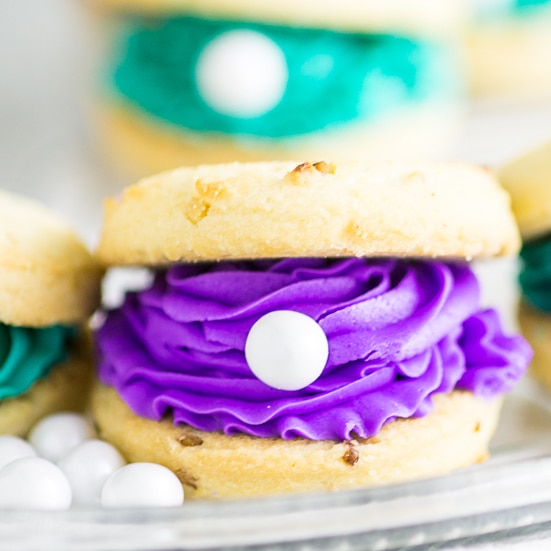 Oyster Cookies with pearls are the perfect treat for a mermaid, beach, Finding Nemo, Finding Dory, or under-the-sea themed party! Everything's better under the sea, including these colorful oyster pearl cookies! 