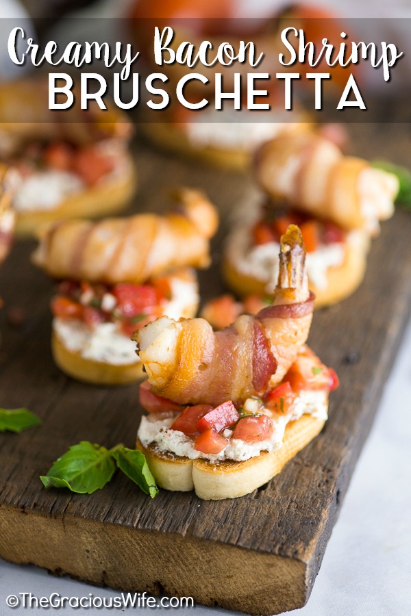 Creamy Bacon Shrimp Bruschetta recipe - Perfect appetizers for entertaining! This Creamy Bacon Shrimp Bruschetta recipe has it all with toasted baguette, a creamy garlic herb and bacon spread, balsamic vinaigrette, and THE BEST fresh basil and tomato bruschetta. Topped with a succulent bacon-wrapped shrimp! Make it for all your summer parties!