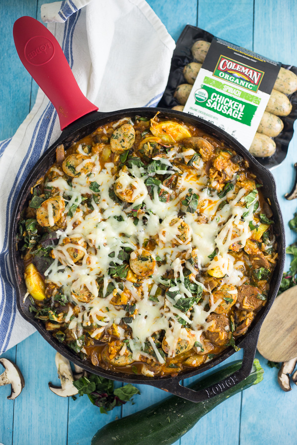 Zesty spinach chicken sausage and fresh veggies in a vibrant tomato sauce and covered in cheese in this Cheesy Chicken Sausage and Spinach Skillet Dinner recipe for an easy family dinner made in just one skillet in 30 minutes. This quick and easy sausage, veggie and rice skillet is downright delicious!