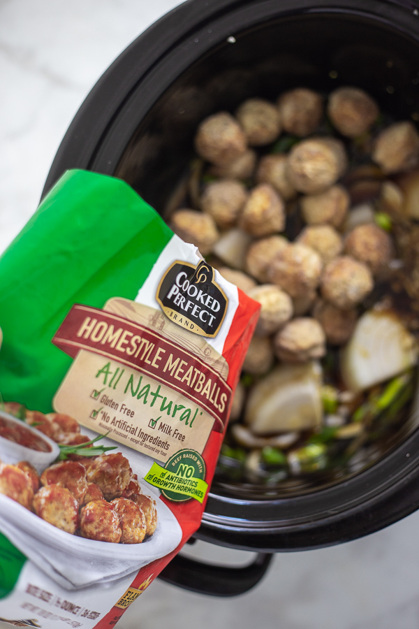 Slow Cooker Mongolian Meatballs are a super easy appetizer recipe featuring savory slow cooker meatballs in a sticky Mongolian glaze sauce.  This restaurant inspired recipe is a family favorite perfect for game day food, holiday appetizers for a crowd, or even served with rice for dinner.