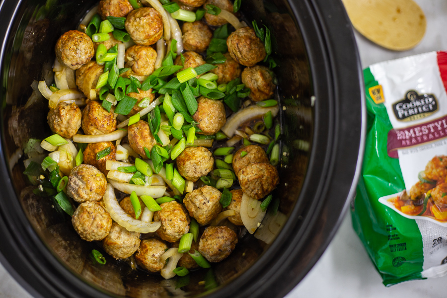 Slow Cooker Mongolian Meatballs are a super easy appetizer recipe featuring savory slow cooker meatballs in a sticky Mongolian glaze sauce.  This restaurant inspired recipe is a family favorite perfect for game day food, holiday appetizers for a crowd, or even served with rice for dinner.
