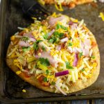 This Flatbread Hawaiian Pizza is quick, easy, and totally delicious! An addicting tangy, salty sweet combination with ham, pineapple, cheese, and a little bacon for good measure. 