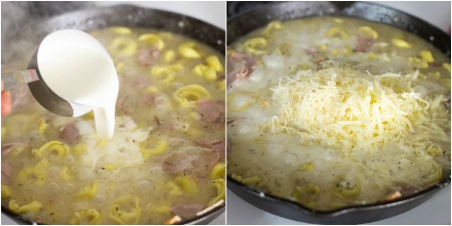 Cream and shredded cheese being added to tortellini, ham, and broth mixture in a cast iron skillet