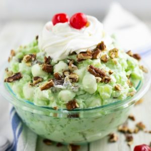 Creamy Watergate salad is a quick and easy dessert made with whipped cream, pistachio pudding, pineapple, and marshmallows. A crazy combination that's a real hit at parties and gatherings.