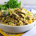 Juicy ground beef and warm noodles tossed in a creamy sauce seasoned with fresh mushrooms, onion, and garlic makes a classic easy comfort dish. Make this Ground Beef Stroganoff recipe in just one pot! This is THE BEST homemade, from scratch stroganoff you will ever make!